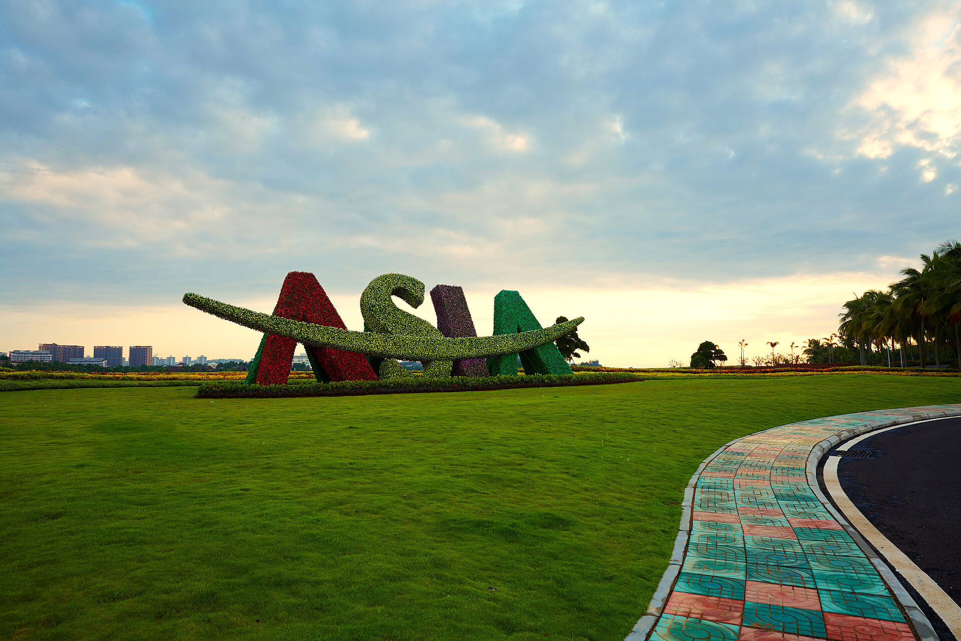 Floral ASIA sculpture with an airplane in a landscaped park in Bo’Ao, Hainan, China.
