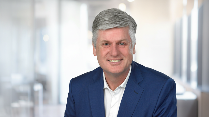 Professional portrait of Werner Fischer, CeramTec representative, smiling in a business setting at DKOU 2026 Berlin.